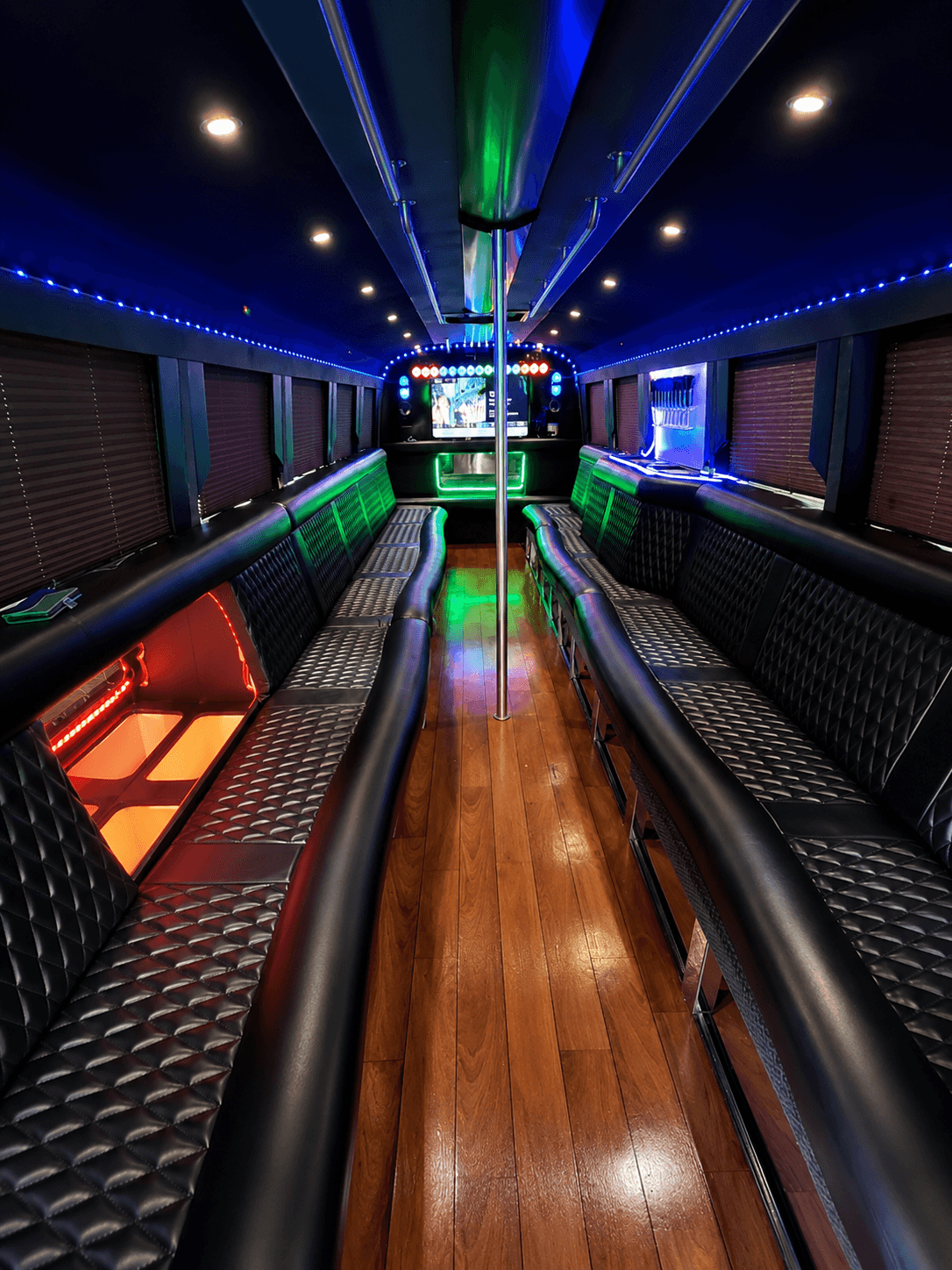 Vibrant LED interior of the Triangle Party Wheels luxury party bus
